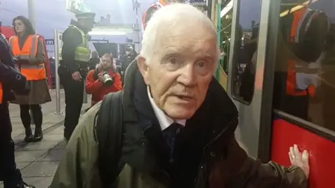 Extinction Rebellion Phil Kingston glued to one of the Tube trains