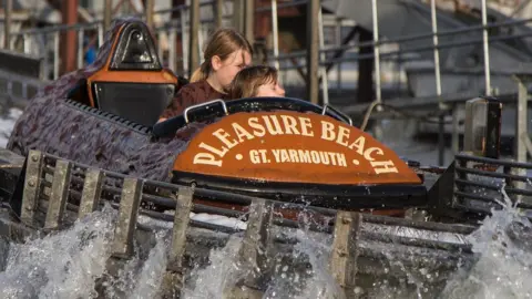 David P Howard/Geograph Two children on the Great Yarmouth Pleasure Beach log flume