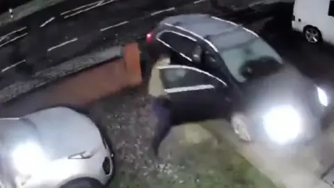 A car being driven towards a wall