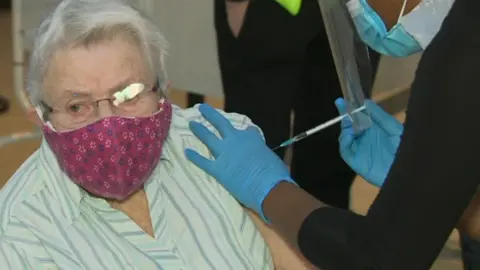 Enid receiving vaccine in Aylesbury