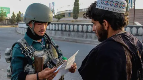 EPA Government soldier at checkpoint in Kandahar