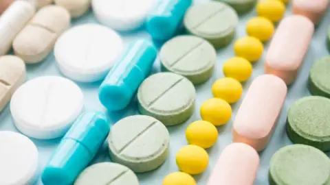 Getty Images Different kinds of multi-coloured pills.