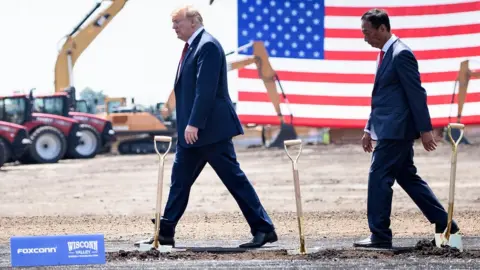 Getty Images US President Donald Trump (L) and Foxconn Chairman Terry Gou leave after a groundbreaking for a Foxconn facility at the Wisconsin Valley Science and Technology Park June 28, 2018 in Mount Pleasant, Wisconsin