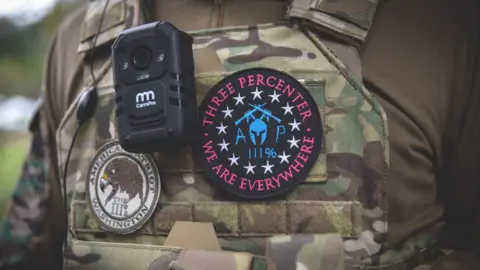 Getty Images Three Percenter militia insignia