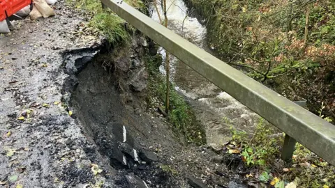 BBC A wall next to the river collapsed