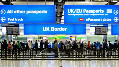 Alamy Immigration and passport control at Heathrow airport