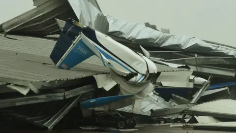 AFP A badly damaged light plane in its hanger at Rockport Airport after heavy damage when Hurricane Harvey hit Rockport, Texas on August 26, 2017.