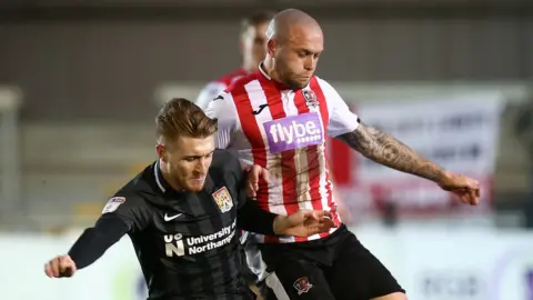 Getty Images Nicky Law of Exeter City wearing shirt with Flybe logo