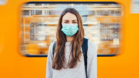 Getty Images Woman wearing mask