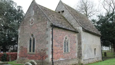 Peter Martindale St Mary's exterior with the church surrounded by trees