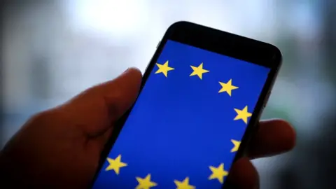 Getty Images A smartphone with the flag of the European Union on its screen