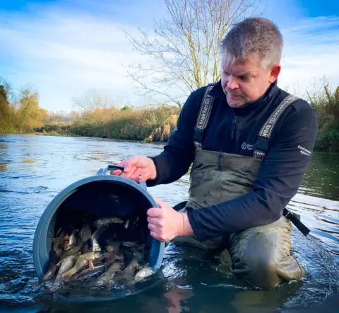 Environment Agency Man with fish