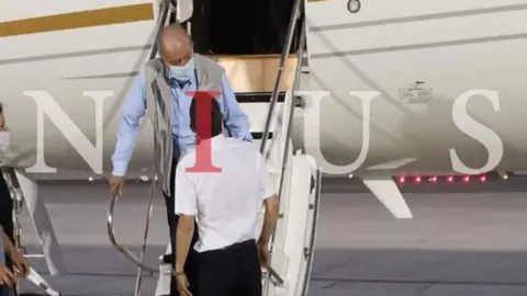 NIUS A Nius photograph which appears to show Juan Carlos arriving in Abu Dhabi