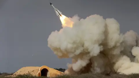 AP File photo, released by semi-official Iranian Students News Agency, of a long-range S-200 missile fired in a military drill in the port city of Bushehr