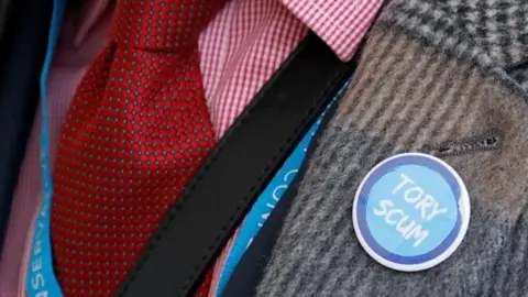 Reuters 'Tory Scum' badge