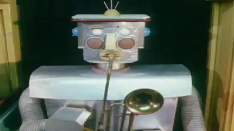 Robot man playing a brass instrument at Turner's Musical Merry-go-Round in Northamptonshire in 1983.