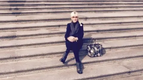 Courtesy Erin Brockovich Erin Brockovich on the Steps of the Supreme Court March 2015