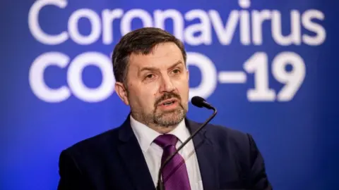 PA Media Health Minister Robin Swann