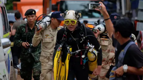 Getty Images British cave-diver John Volanthen walks out from Tham Luang Nang Non cave in full kit, 28 June