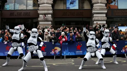 Reuters People dressed as stormtroopers from Star Wars dancing