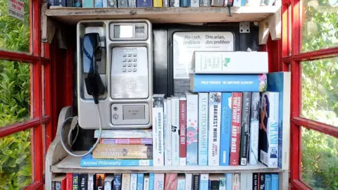 Getty Images A phone box that has been converted into a library