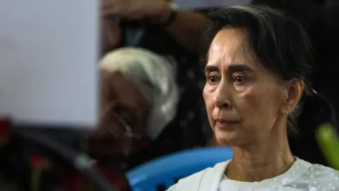 AFP/Getty Images Myanmar's State Counsellor Aung San Suu Kyi attends the funeral service for the National League for Democracy (NLD) party's former chairman Aung Shwe in Yangon on 17 August 2017.