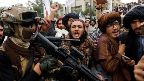 Reuters Taliban supporters rejoice on the first anniversary of the fall of Kabul