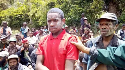 Scott waide A boy who lost his whole family in a quake, Huiya, Papua New Guinea