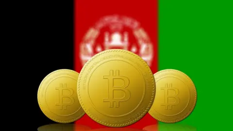 Getty Images Graphic with Bitcoin symbols over an Afghan flag