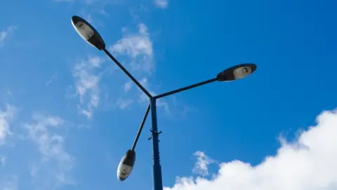 David Crespo/Getty Images Three street lights from one pole