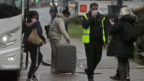 PA Media People arrive for hotel quarantine