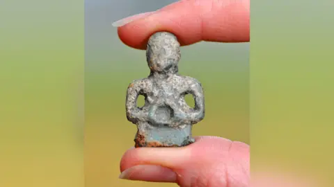 NAtional trust/Oxford Archaeology Celtic figurine before it was cleaned