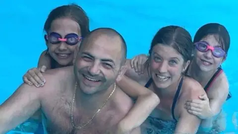 Family photo The Lanciano family in a swimming pool