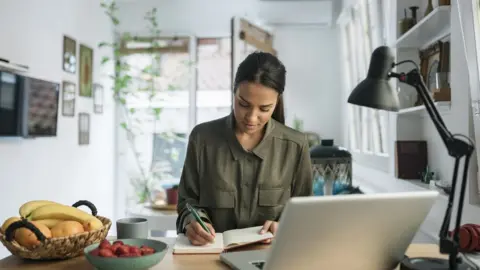 Getty Images Young woman looking for work