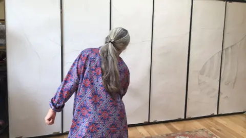 Kimmy McHarrie Kimmy McHarrie working on the design for the mosaic