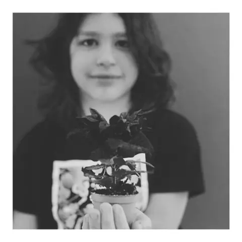 Richard Tymon Mable with a small plant