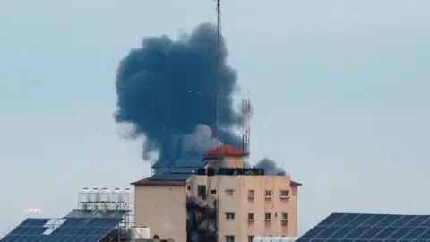 Reuters Smoke rises after an Israeli air strike in northern Gaza on 23 February 2023