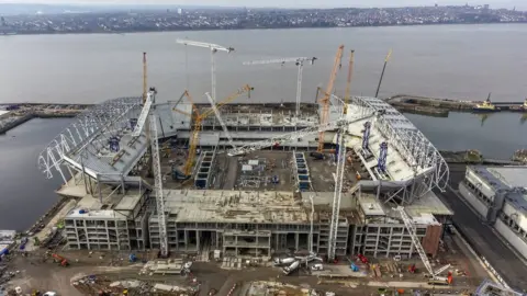 PA Media Aerial view of Everton's new stadium being built against the backdrop of the River Mersey