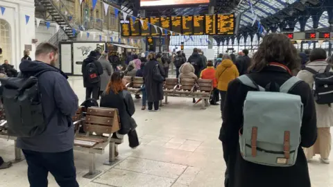 BBC Passengers waiting at Brighton Station