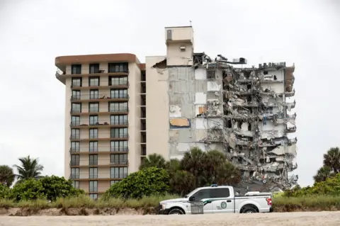 Reuters A building that partially collapsed is seen in Surfside, near Miami Beach, Florida, U.S., June 24, 2021.