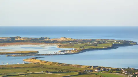 Getty Images Mochras, known as Shell Island, near Llanbedr