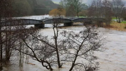 Getty Images The River Tweed busts its banks in the Scottish Borders