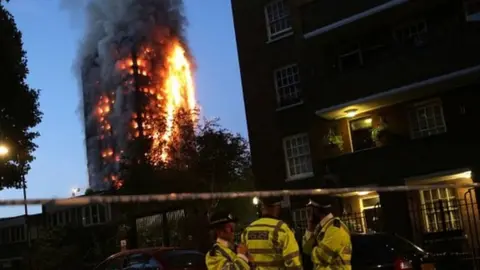 Getty Images Police man the cordon during Grenfell Tower block fire