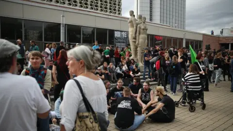 Getty Images People gather for a demonstration to protest against racism and right-wing extremism in Chemnitz, 27 August