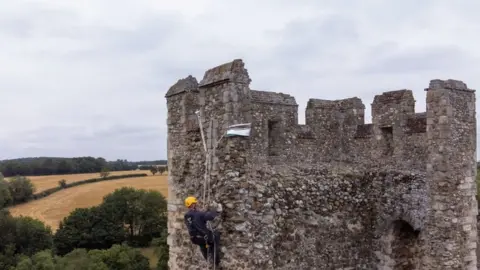 PA Media Joe Picalli carries out high-level repairs on Framlingham Castle