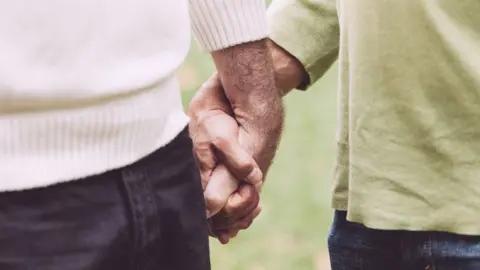 Getty Images men holding hands