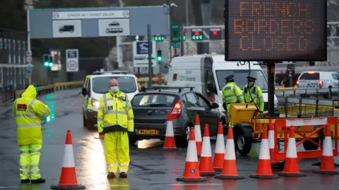 Reuters Security officers stand guard at an entrance of the Port of Dover