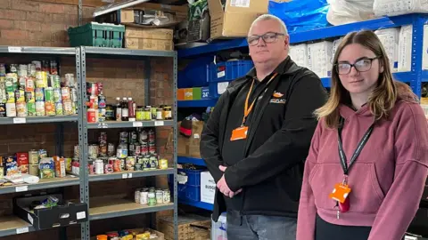 BBC Mike Holt and Cerys Toner-Furlong with supplies at Maninplace