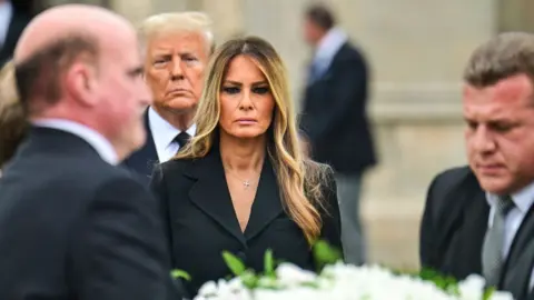 ormer US First Lady Melania Trump (C), with her husband former US President Donald Trump (rear), leaves the funeral service for her mother, Amalija Knavs, at the Church of Bethesda-by-the-Sea in Palm Beach, Florida, on January 18, 2024