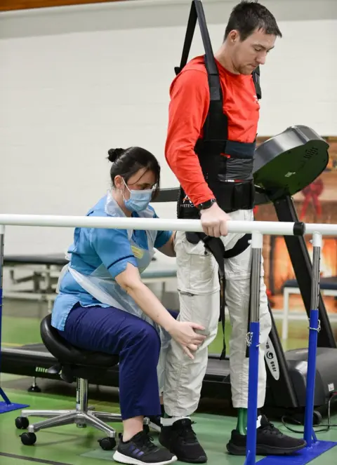 PA Media Mr Louden has been undergoing a new type of therapy at the Queen Elizabeth National Spinal Injuries Unit in Glasgow